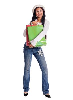 Young Woman shopping holding bags wearing warm clothes isolated