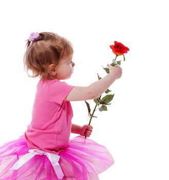 Little girl holding red rose isolated on white