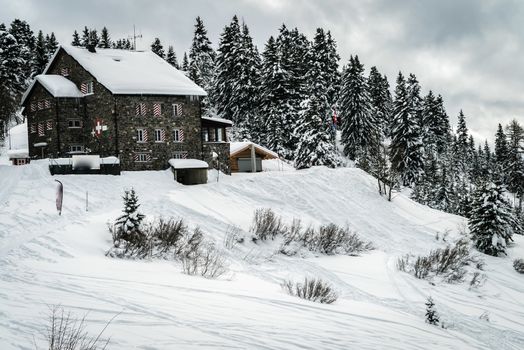 A mountain refuge covered with snow in Switzerland