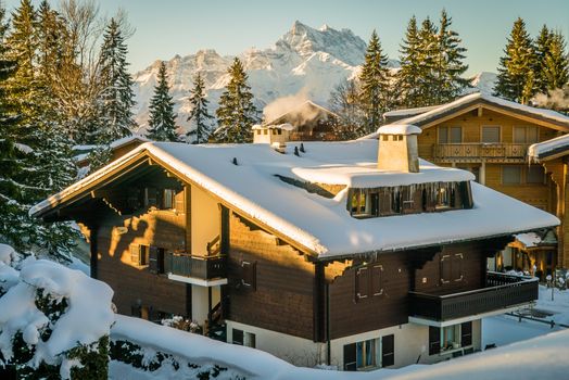 Chalet covered with snow in Villars-sur-Ollon in Switzerland