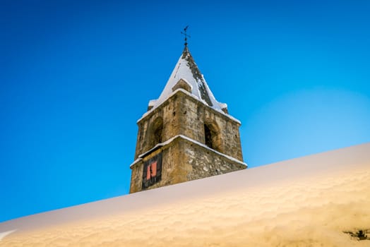 Clock tower of Gryon with snow in the winter in Switzerland