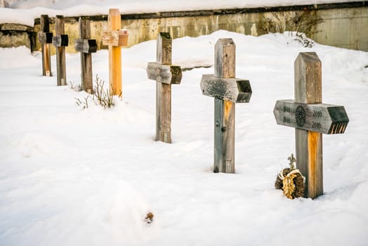 Cemetery under the snow in winter in Switzerland