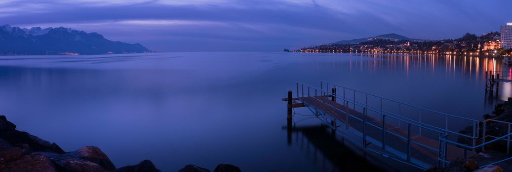 Pier in Montreux just after sunset with a blue light in the winter