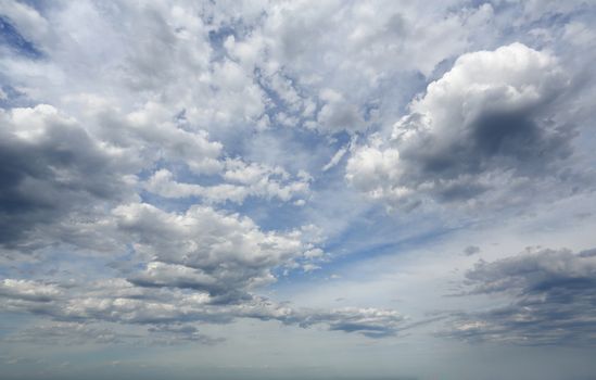 Amazing sheer high cloud mixed with heavier grey clouds moving across the sky in summer.  Australia