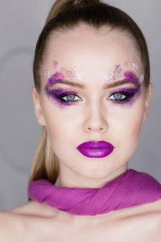 Beauty Makeup. Purple Make-up and Colorful Bright Nails. Beautiful Girl Close-up Portrait.