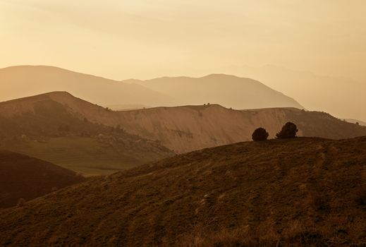 Misty sunset landscape in Chimgan mountains, Uzbekistan