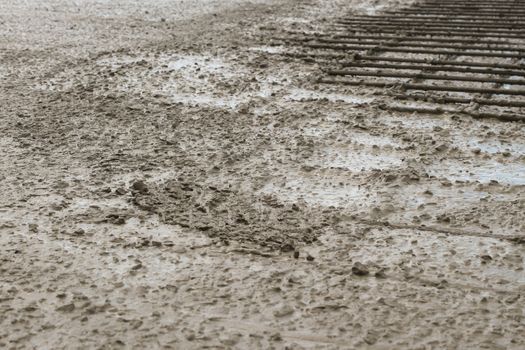 workers at the construction site poured concrete floor.