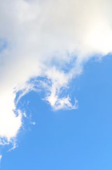 background with light blue sky in the bottom, and softy white cloud above, vertical