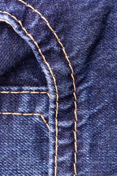 denim jeans background with seam of jeans fashion design. Old grunge vintage denim jean