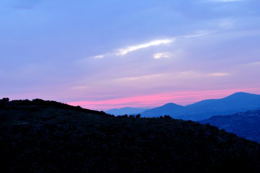 background with sky and hill at blue hour, italian countryside