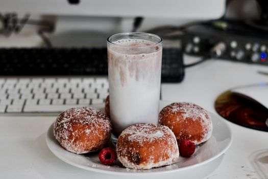 Delicious doughnuts on the white plate. Sweet fresh food concept.