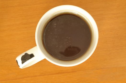 tea break in the office, a cup of tea from above on a desk