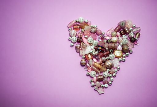 collection of Pink glass beads shaped into a heart