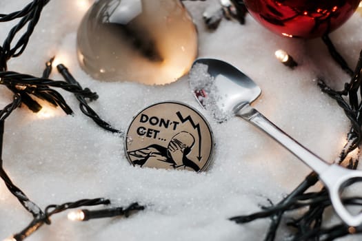 Digital currency physical metal bitcoin coin. Crypto currency christmas snow composition.