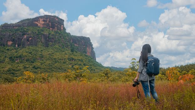 Asian woman backpacker enjoy the view at mountain