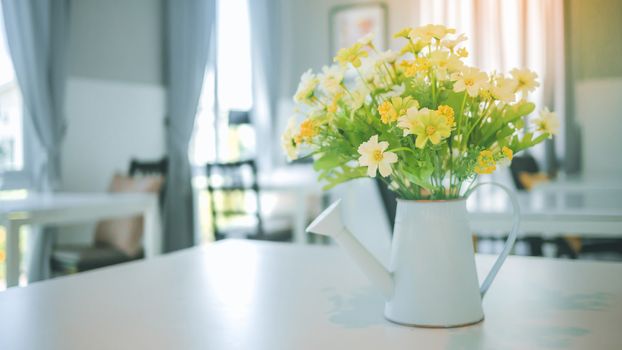 A bouquet of artificial flowers in pot