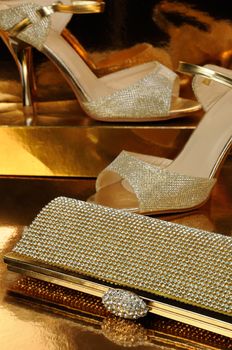 Golden clutch inlaid with rhinestone and a pair of gold shoes