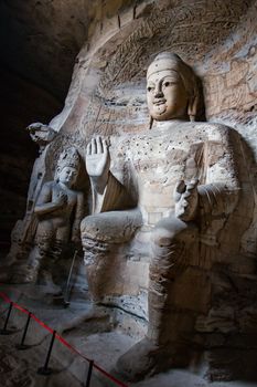 Giant stone Buddha scultpures in one of the main caves at the Yungang Grottos.