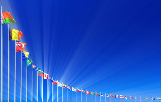 Flags and sunbeams against blue sky, copyspace