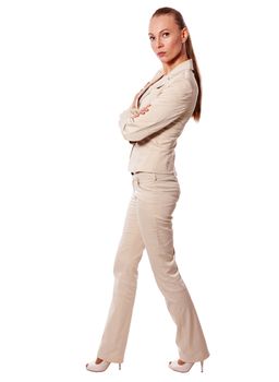 One Standing business woman wearing beige suit isolated on white