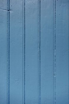 Old wood board painted blue background texture