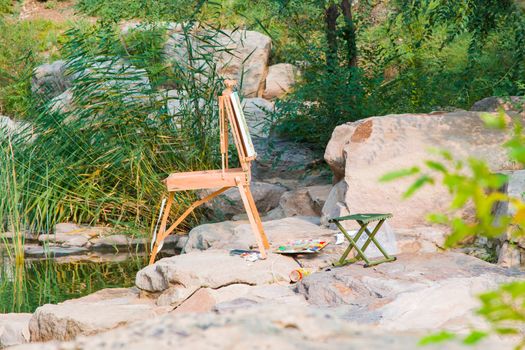 An artist's travel easel all set up ready to go.