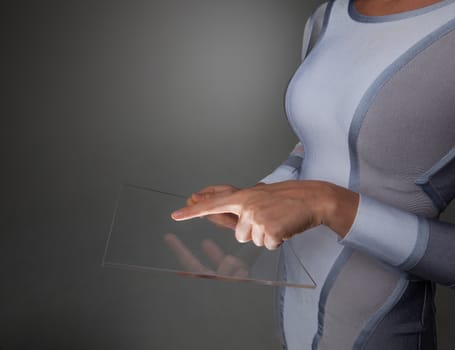 Female hands holding blank futuristic transparent digital tablet pc computer with copy space