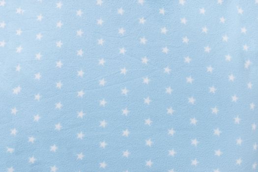 Texture background of a star shape blue wool blanket.