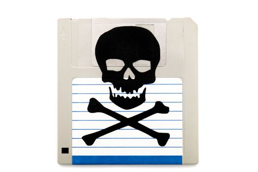 Close up view of a infected computer floppy disk isolated on a white background. Conceptual image with skull and bones.