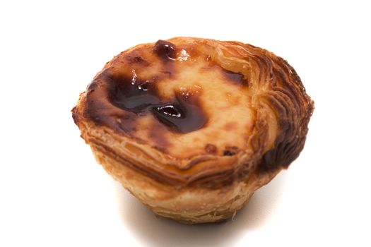 Famous Portuguese egg pastry tart called 'Pastel de Belem' isolated on white background.