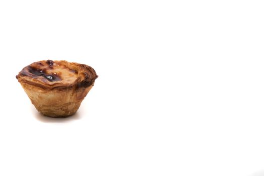 Famous Portuguese egg pastry tart called 'Pastel de Belem' isolated on white background.
