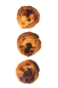 Famous Portuguese egg pastry tart called 'Pastel de Belem' isolated on white background.