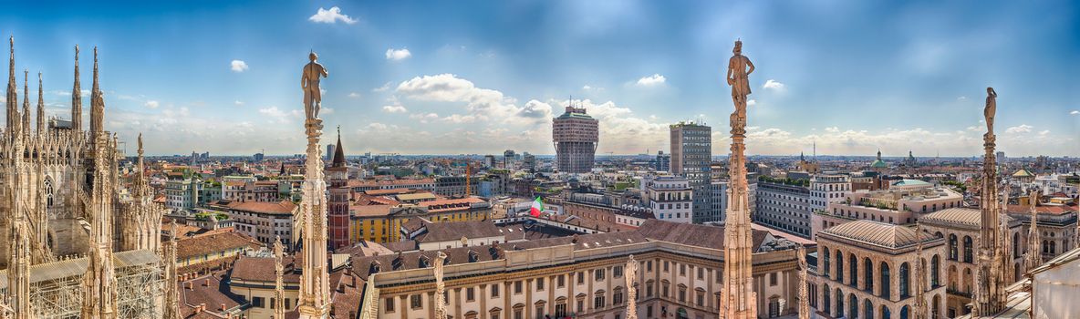 Panoramic aerial view over the city centre, as seen from the roof of the gothic Cathedral, Milan, Italy