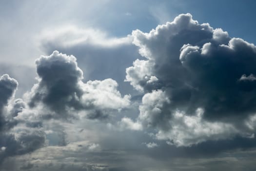 Dramatic Autumn clouds backlit by Sun.