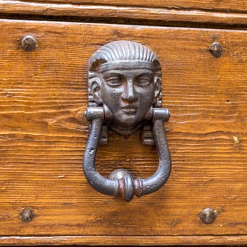 Close up of rustic old door in Spoleto, Italy.