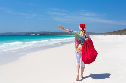 Christmas in Australia.  female enjoying the fabulous sunshine on one of Australias beautiful beaches in summer