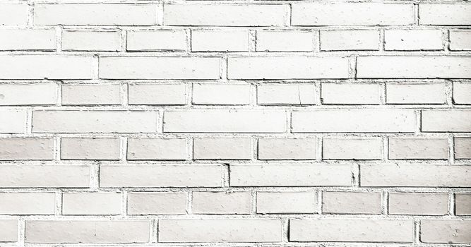 Grungy painted brick wall texture as background. Cracked concrete vintage brick wall background, old painted wall. Background brick painting