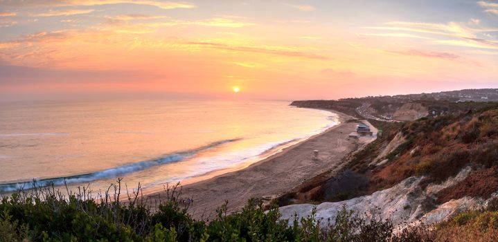 Sunset over the farthest south end of Crystal Cove beach, Southern California in summer