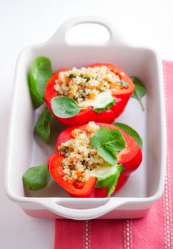 Stuffed red peppers filled with quinoa and vegetables