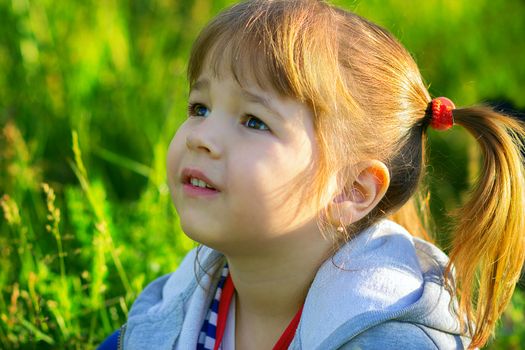 the little girl looks up, a portrait