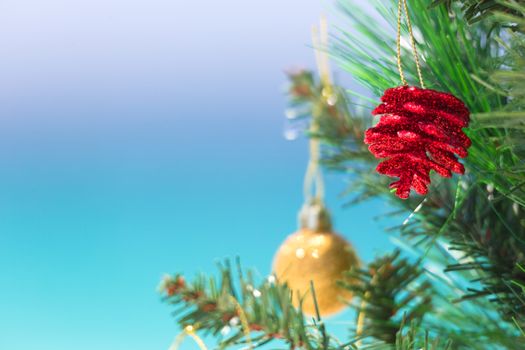 Christmas beach background.   Christmas tree closeup shallow dof with beach blur