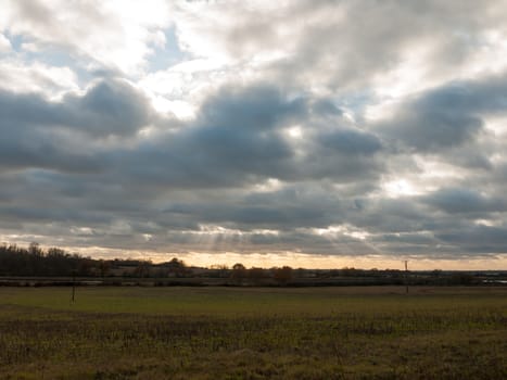 dramatic clouds sky autumn weather open grassland plain landscape; essex; england; uk