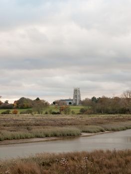 stream estuary running through countryside autumn Alresford Creek church; essex; england; uk