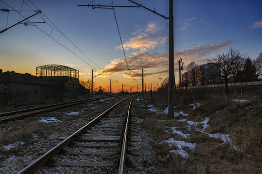 Industrial landscape with railroad and beauty colorful sky. Railway junction.