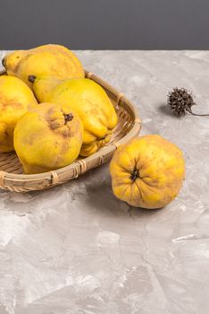 Ripe quince fruits on kitchen countertop.