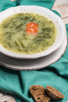 Caldo verde popular soup in Portuguese cuisine. traditional ingredients for caldo verde are potatoes, collard greens , olive oil and salt. Additionally garlic or onion may be added.