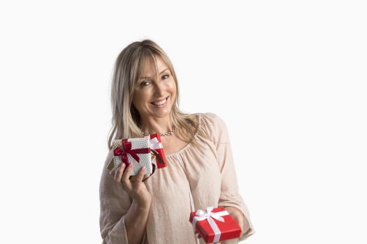 Woman holding wrapped gifts presents and holding one out  Giving, sharing, birthday, Christmas