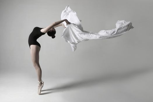 Beautiful Ballet Dancer in Studio on White Background