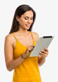 Beautiful and happy young woman working with a tablet