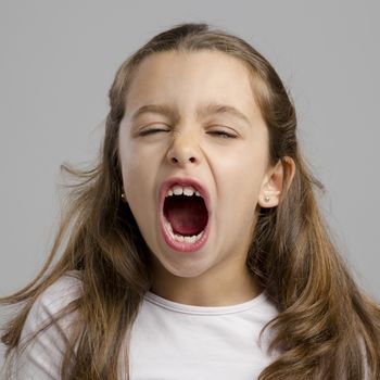 Portrait of a little girl with her mouth open